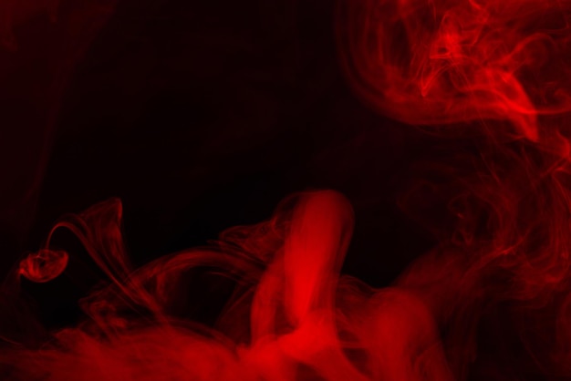 Premium Photo | Red steam on a black background. copy space.