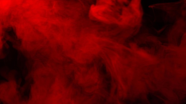 Red steam on a black background. Copy space.