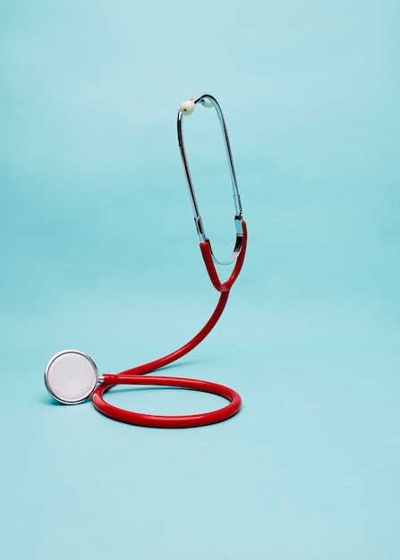 Red Stethoscope on bright pastel blue