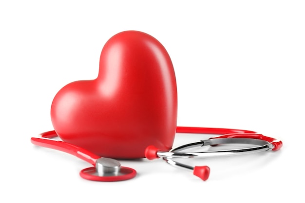 Red stethoscope and heart on white