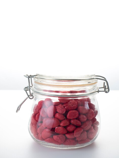 Red stone in a glass bottle