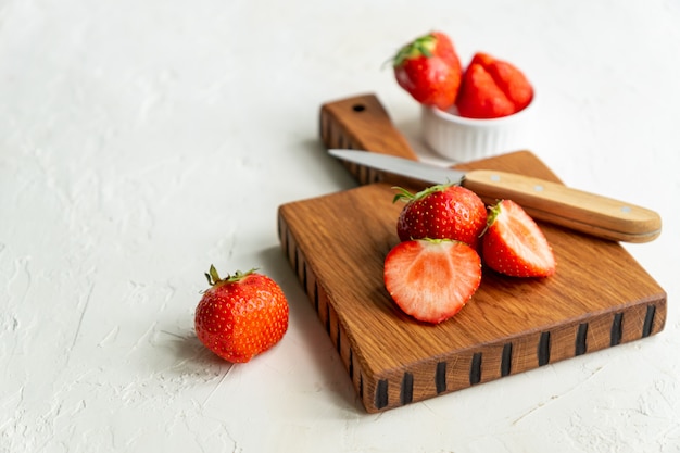 Red strawberries on a cutting desk