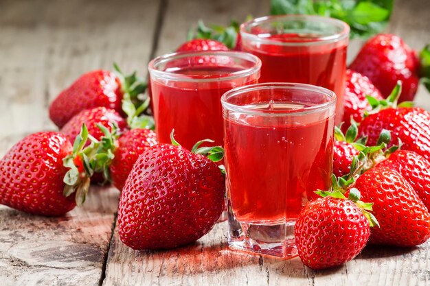 Red strawberry drink and fresh berries selective focus