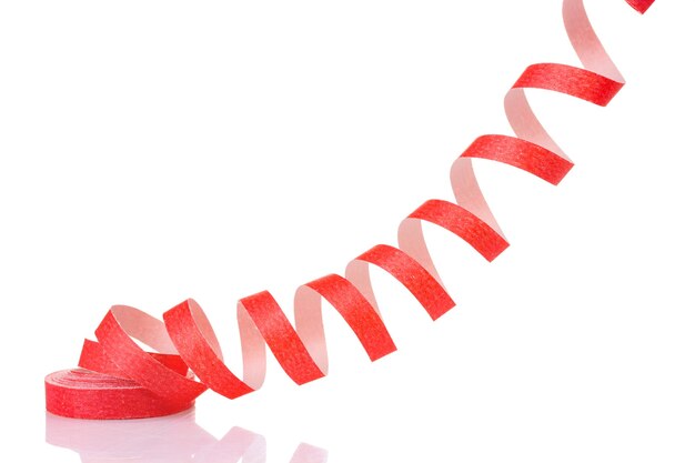 Red streamer isolated on white