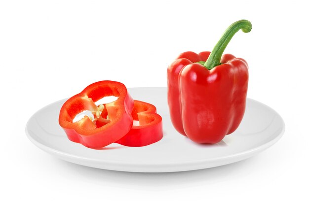 Red sweet pepper in plate isolated