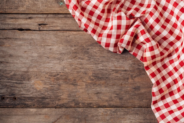 red table cloth on old wooden background