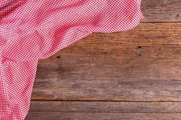 red table cloth on wooden background