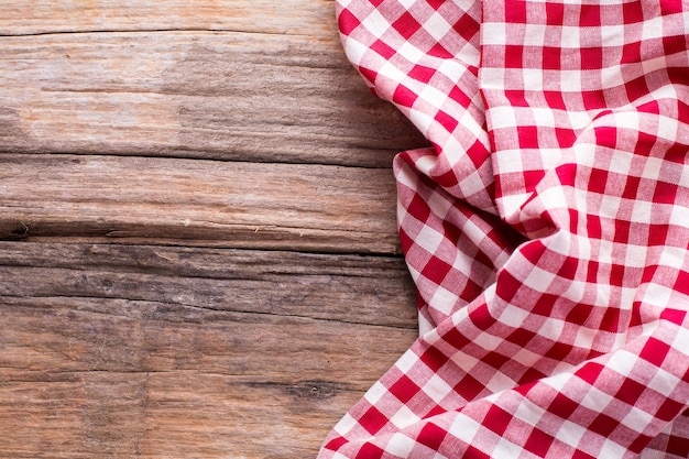 red table cloth on wooden background