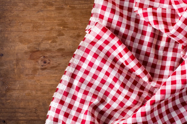 red table cloth on wooden background