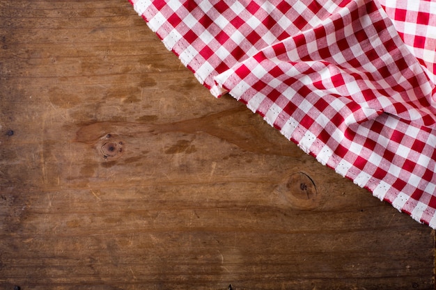 red table cloth on wooden background