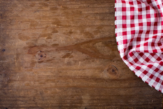 red table cloth on wooden background