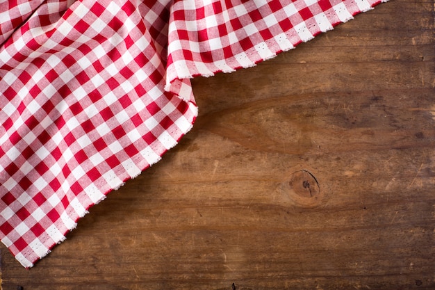 red table cloth on wooden background