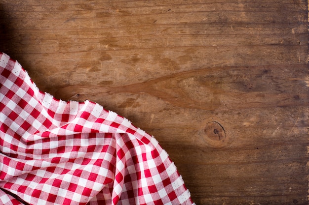 Red table cloth on wooden table