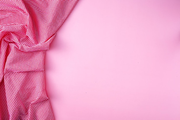 Red tablecloth on pink background