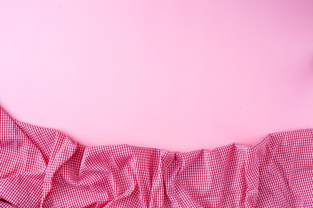 Photo red tablecloth on pink background