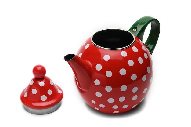 Red teapot with white circles on isolated white