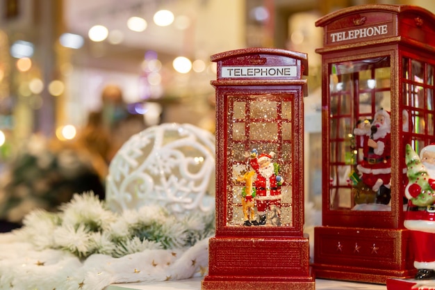 Red telephone booths with Santa Claus, christmas. Selective focus