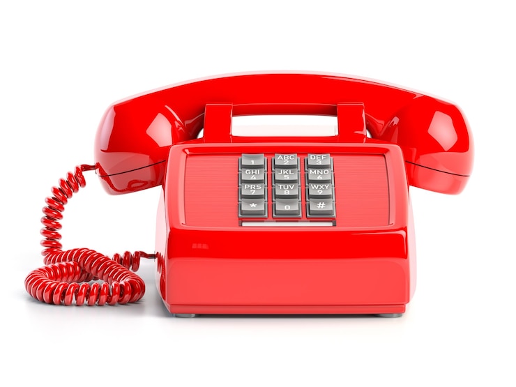 Photo red telephone front view of vintage retro push button telephone isolated on white