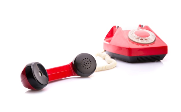 Red telephone on white