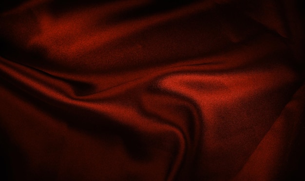 Red texture - dark wavy glossy silk drapery.