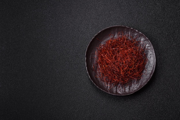 red thin hot chili threads on a dark background