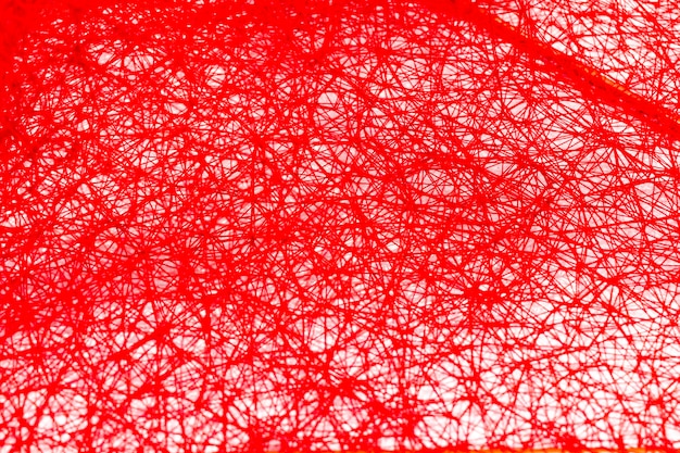 Red threads weft forming a background.