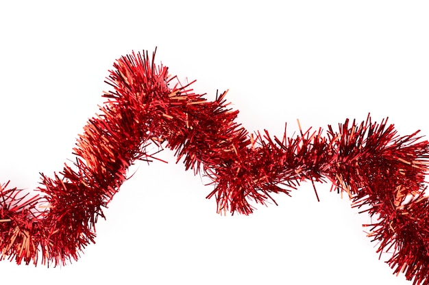 Red tinsel on white background.