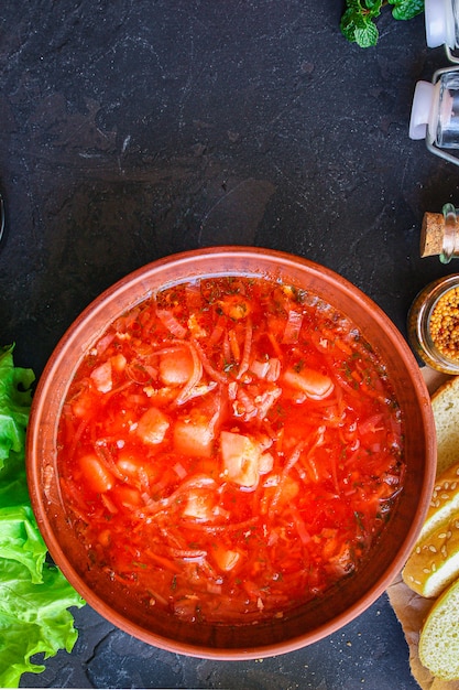 red tomato soup and vegetables and meat, borsch