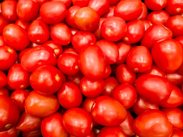 Red tomatoes background tomatoes background top view