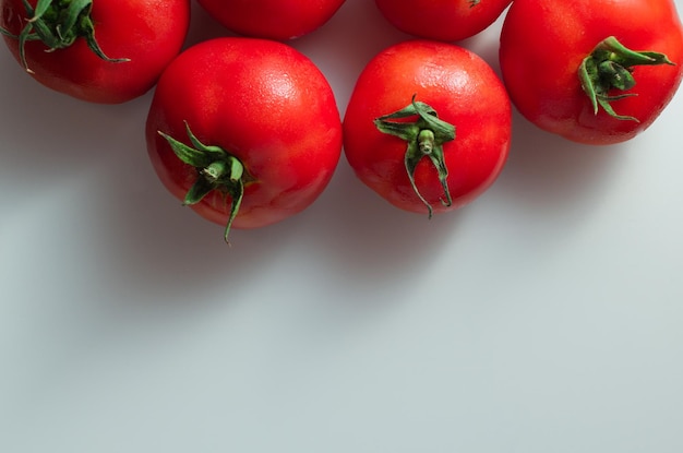 Red tomatoes isolated on white background