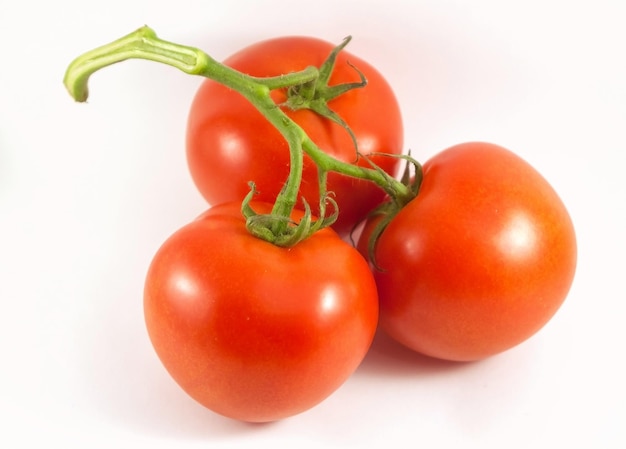 Red tomatoes isolated on white