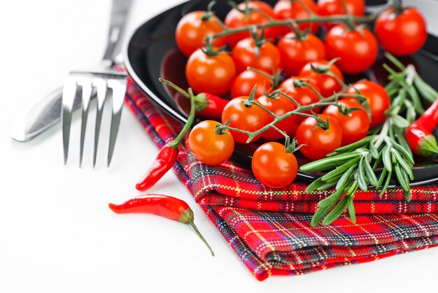 Red tomatoes on a white background