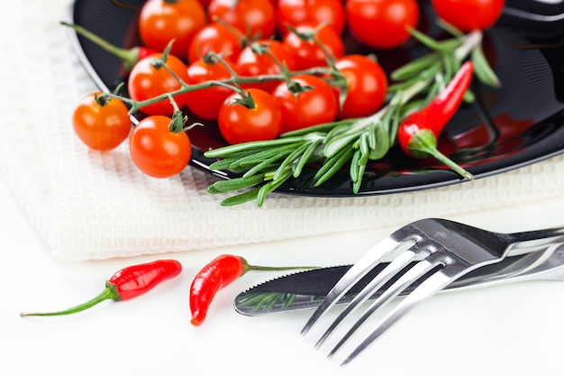 Red tomatoes on a white background