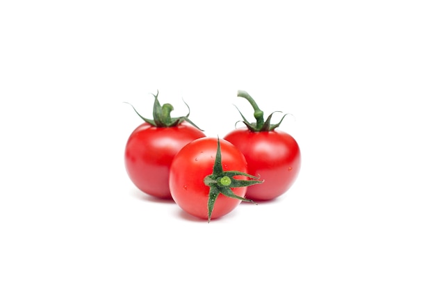 Red tomatoes on white background