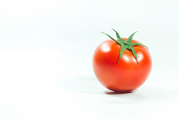 Red tomatoes on  White