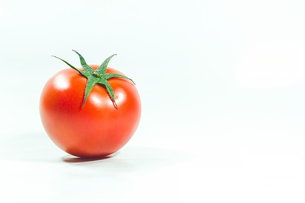 Red tomatoes on  White