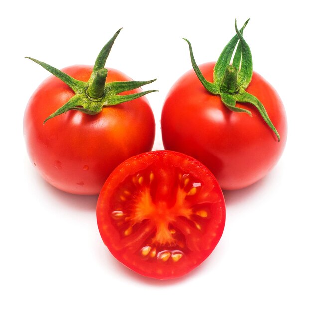 Red tomatoes whole and pieces isolated on white background. Vegetables. Organic food. Tasty and healthy. Flat lay, top view