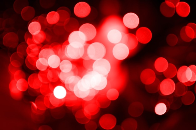 Photo red tone blur bokeh light for design. defocused texture abstract background