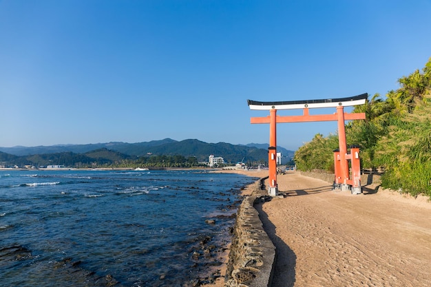 Red torii in Aoshima Shrine with blue sky