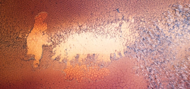 Red toxic water in the tank of the mining and processing plant.