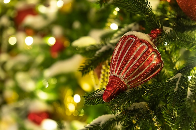 Red toy Christmas decorations and toys on Christmas tree