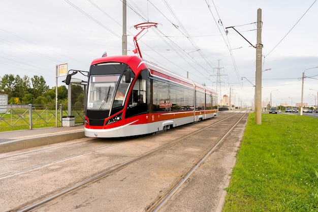 Red Tram at stop. Summer. Selective focus