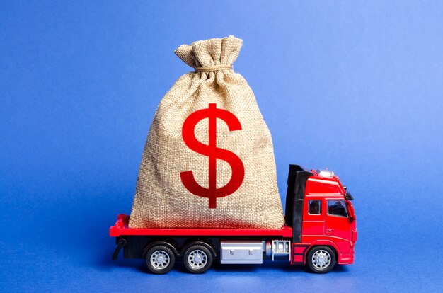 Red truck carries a big bag of money.