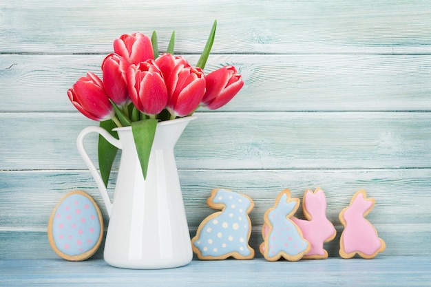 Red tulip flowers and Easter cookies