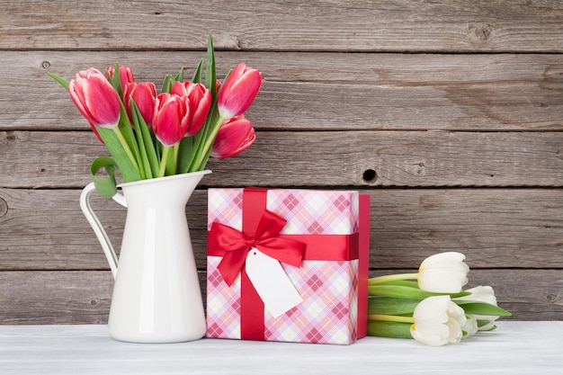 Red tulips bouquet and gift box