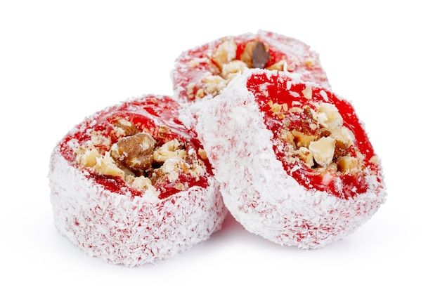 Red Turkish delight with nuts in powdered sugar isolated on white backgorund