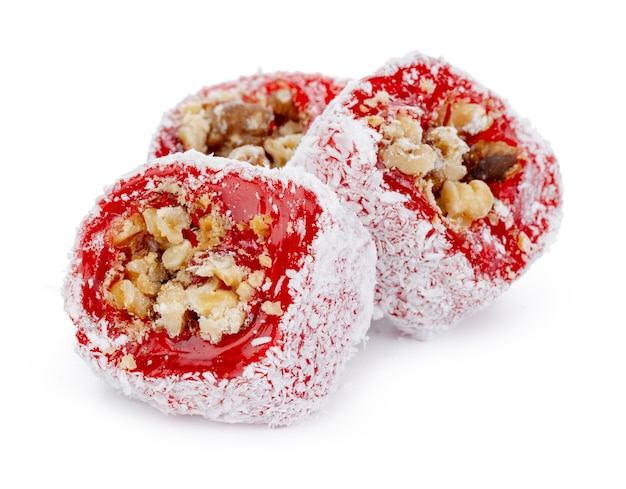 Red turkish delight with nuts in powdered sugar isolated on white