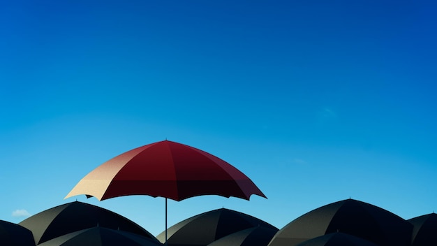 Red umbrella standing out from many black umbrella .
leadership, independence, initiative, strategy, think different,
business success concept .