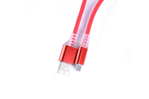 Red USB cable for smartphone charge isolated