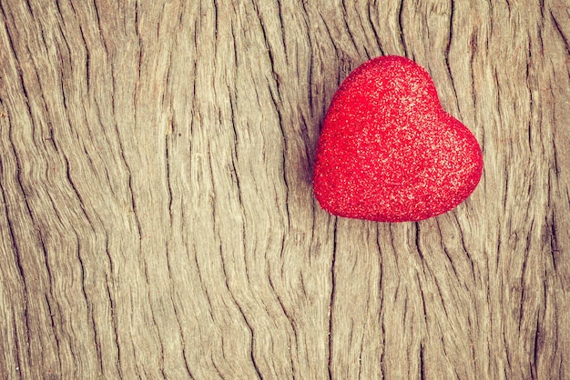 red valentine heart on grunge wooden background